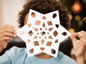 a paper cut out snowflake