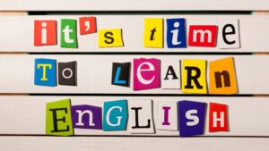 a photo of the words 'it's time to learn English' in letters of different sizes, fonts and colors