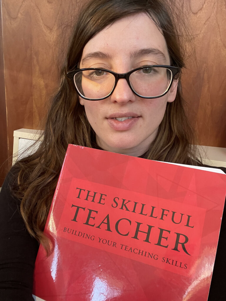 a photo of me holding 'the skillful teacher: buildding your teaching skills" a book to help you improve your teaching